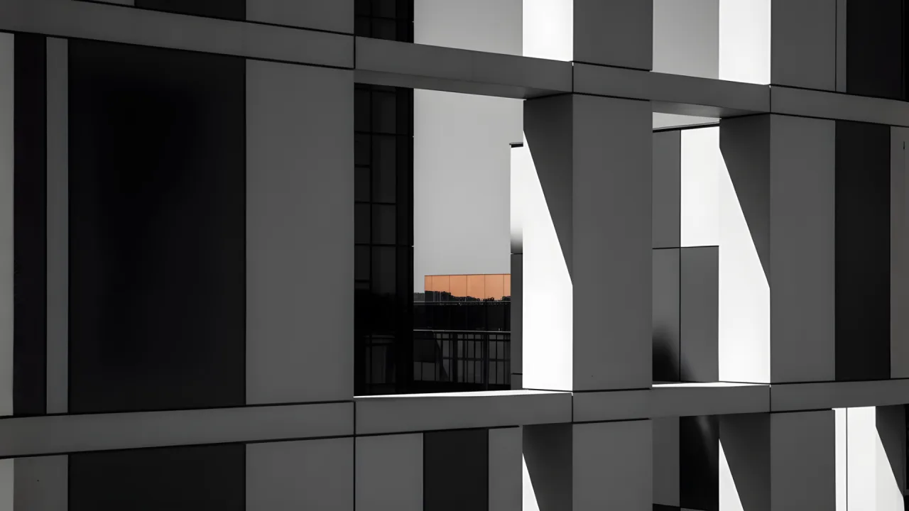 Structured contracting website concept presented over a geometric architectural facade